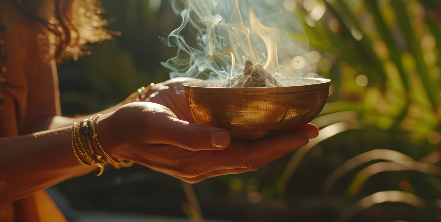 Woman holding a bowl for home blessing and energetic cleansing in San Diego